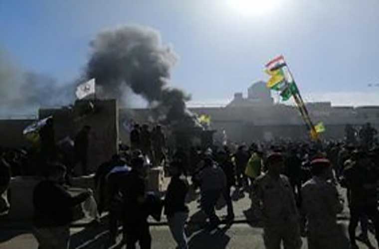 Iraqis storm US embassy in Baghdad to protest against airstrikes