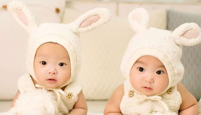 Why is the rate of twin births increasing in world?